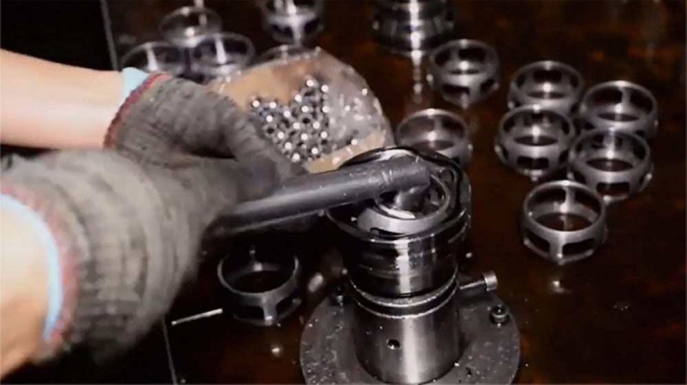 Technician assembling CV joint components